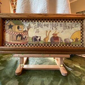 Charming framed wall art of animals disembarking Noah’s ark. Sweet kitchen decor